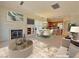 Open living space with fireplace, eat in dining area, and kitchen with breakfast bar at 21 Via Visione # 206, Henderson, NV 89011