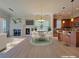 Open living space with fireplace, eat in dining area, and kitchen with breakfast bar at 21 Via Visione # 206, Henderson, NV 89011