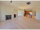 Open living space with fireplace, eat in dining area, and kitchen with breakfast bar at 21 Via Visione # 206, Henderson, NV 89011
