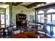 Community lounge area featuring a pool table, seating, and a bar area with pendant lighting and dark wood finishes at 21 Via Visione # 206, Henderson, NV 89011