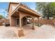 Exterior view of the backyard showing the covered patio and low-maintenance landscaping at 2307 Tuscarora Ct, Las Vegas, NV 89142