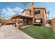 Spacious backyard featuring a covered patio and desert landscaping at 2307 Tuscarora Ct, Las Vegas, NV 89142
