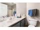 Clean bathroom with a sleek countertop, a toilet, and well-organized toiletries at 2307 Tuscarora Ct, Las Vegas, NV 89142