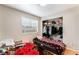 Cozy bedroom features natural light, a closet, and laminate wood flooring at 2307 Tuscarora Ct, Las Vegas, NV 89142