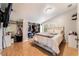 Inviting bedroom featuring wood-look floors and a walk-in closet at 2307 Tuscarora Ct, Las Vegas, NV 89142