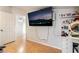 Bright bedroom showcasing hardwood floors, TV, and ample lighting at 2307 Tuscarora Ct, Las Vegas, NV 89142