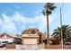 Two-story home featuring a two-car garage, driveway, a front yard, and desert landscaping at 2307 Tuscarora Ct, Las Vegas, NV 89142
