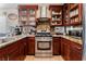 Beautiful kitchen with stainless steel appliances, granite countertops, and custom wood cabinetry at 2307 Tuscarora Ct, Las Vegas, NV 89142