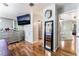 Spacious main bedroom with hardwood floors, TV, mirror, and ample natural light at 2307 Tuscarora Ct, Las Vegas, NV 89142