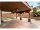 Spacious covered patio area with ceiling fans overlooking the fenced backyard at 2307 Tuscarora Ct, Las Vegas, NV 89142