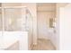 Bright bathroom featuring a glass shower, white cabinetry, a vanity, and neutral walls at 2383 Thayer Ave, Henderson, NV 89074