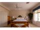 Spacious bedroom featuring a ceiling fan, neutral walls, natural lighting, and beautiful decor at 2383 Thayer Ave, Henderson, NV 89074