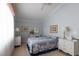 Cozy bedroom featuring a floral bedspread, matching lamps, and blue walls creates a serene retreat at 2383 Thayer Ave, Henderson, NV 89074
