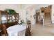 A dining room featuring a table, chairs, china cabinet, chandelier, and open access to other rooms at 2383 Thayer Ave, Henderson, NV 89074
