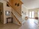 Elegant entryway with staircase, tiled floor, and classic decor at 2383 Thayer Ave, Henderson, NV 89074