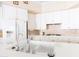 Bright kitchen with white cabinets, gas cooktop, and stainless steel faucet at 2383 Thayer Ave, Henderson, NV 89074