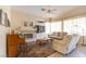 Cozy living room with fireplace, piano, and neutral decor at 2383 Thayer Ave, Henderson, NV 89074