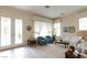 Bright living room with large windows and elegant furniture at 2383 Thayer Ave, Henderson, NV 89074