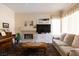 Cozy living room with fireplace, piano, and neutral decor at 2383 Thayer Ave, Henderson, NV 89074