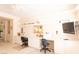 Bright office space with custom built-ins, dual work stations, and a mounted TV offers functionality and style at 2383 Thayer Ave, Henderson, NV 89074