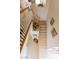 Top-down view of a carpeted staircase with white railings and decorative accents at 2383 Thayer Ave, Henderson, NV 89074
