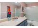 Bathroom featuring modern vanity, framed mirror, and shower with glass doors at 2479 Domingo St, Las Vegas, NV 89121