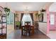 Well lit dining room with chandelier, wood floors, and bright light at 2479 Domingo St, Las Vegas, NV 89121
