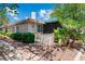 Single-story home featuring desert landscaping and unique architectural details at 2479 Domingo St, Las Vegas, NV 89121