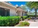 Charming front yard showcasing a lush, well-maintained landscape with mature trees and shrubs at 2479 Domingo St, Las Vegas, NV 89121