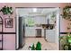 Bright kitchen featuring white cabinets, stainless steel appliances, and tiled backsplash at 2479 Domingo St, Las Vegas, NV 89121