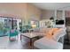 Bright living room with high ceilings, fireplace, and an open floor plan at 2479 Domingo St, Las Vegas, NV 89121