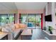 Comfortable living room with fireplace, neutral colors, and lots of plants at 2479 Domingo St, Las Vegas, NV 89121