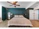 Comfortable main bedroom featuring a ceiling fan, spacious layout, and ample closet space at 2479 Domingo St, Las Vegas, NV 89121