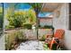 Private patio area with seating, lush landscaping and gate access at 2479 Domingo St, Las Vegas, NV 89121