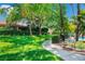 Manicured lawn and pathway leading to community amenities at 2479 Domingo St, Las Vegas, NV 89121