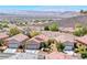 Scenic aerial view of a well-maintained community with mountain views at 2501 Celestial Light Dr, Henderson, NV 89044