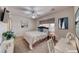 Bedroom features a ceiling fan and modern decor and a window with natural light at 2501 Celestial Light Dr, Henderson, NV 89044