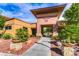 Inviting entrance to the Solera community features desert landscaping and a covered walkway at 2501 Celestial Light Dr, Henderson, NV 89044