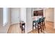 Open entryway with hardwood floors and a view of the kitchen bar at 2501 Celestial Light Dr, Henderson, NV 89044