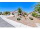 Charming home with desert landscaping, gravel, and bushes for easy maintenance at 2501 Celestial Light Dr, Henderson, NV 89044