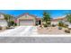 Charming single-story home with a two-car garage and desert landscaping at 2501 Celestial Light Dr, Henderson, NV 89044