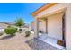 Close-up of the front porch, showcasing desert-style landscaping and neutral colors at 2501 Celestial Light Dr, Henderson, NV 89044