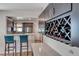 Eat-in kitchen with stainless appliances, peninsula, and ample storage at 2501 Celestial Light Dr, Henderson, NV 89044