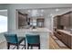 Modern eat-in kitchen with stainless appliances, breakfast bar, and updated countertops at 2501 Celestial Light Dr, Henderson, NV 89044