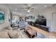 Comfortable living room featuring neutral tones, recessed lighting, and an adjacent workstation at 2501 Celestial Light Dr, Henderson, NV 89044
