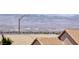 Lovely Nevada mountains are seen from behind the terracotta roofs of the desert community at 2501 Celestial Light Dr, Henderson, NV 89044