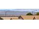 Beautiful view of the Nevada mountains behind the desert homes' terracotta roofs at 2501 Celestial Light Dr, Henderson, NV 89044
