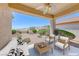 Comfortable outdoor patio featuring a seating area and scenic backyard views at 2501 Celestial Light Dr, Henderson, NV 89044