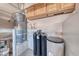 Functional utility room with a water heater, filtration system, and ample space at 2501 Celestial Light Dr, Henderson, NV 89044