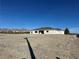 Expansive lot showcasing a modern home and mountain views, providing ample space at 2561 Red Rock Dr, Pahrump, NV 89048
